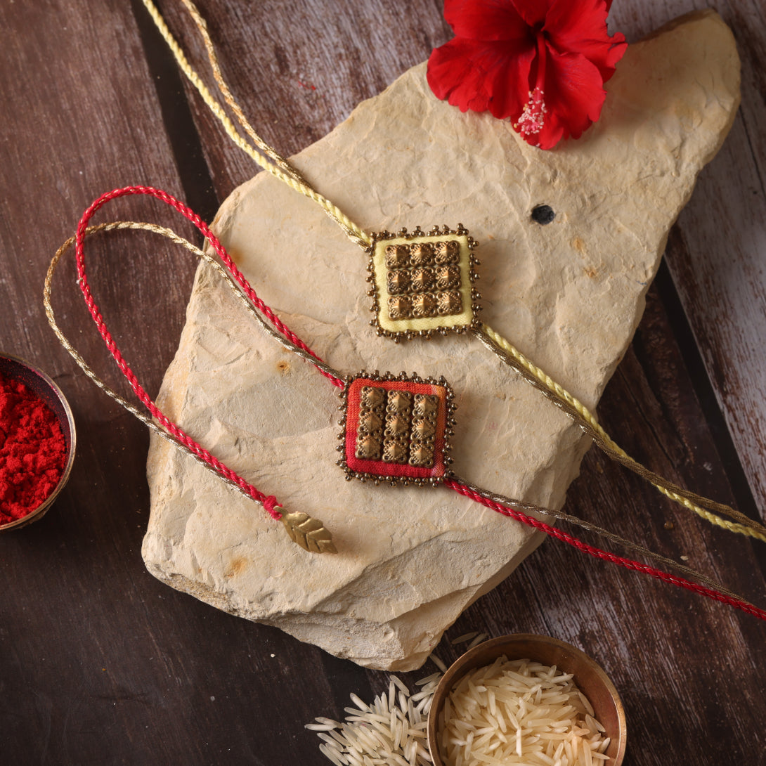 MAJESTIC SQAURE BRASS RAKHI - Set of 2