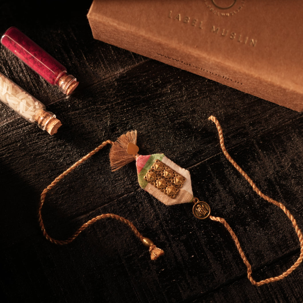 BEIGE - TURTLE TASSLE BLESSING RAKHI