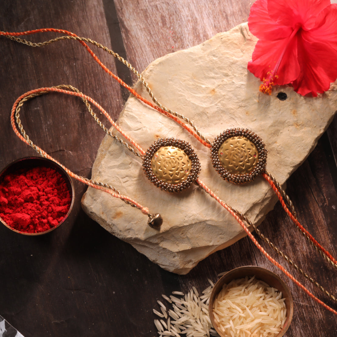 BRASS BLOSSOM RAKHI - Set of 2