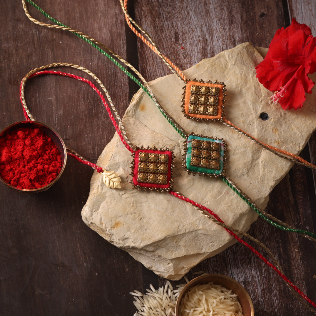 MAJESTIC SQAURE BRASS RAKHI - Set of 3
