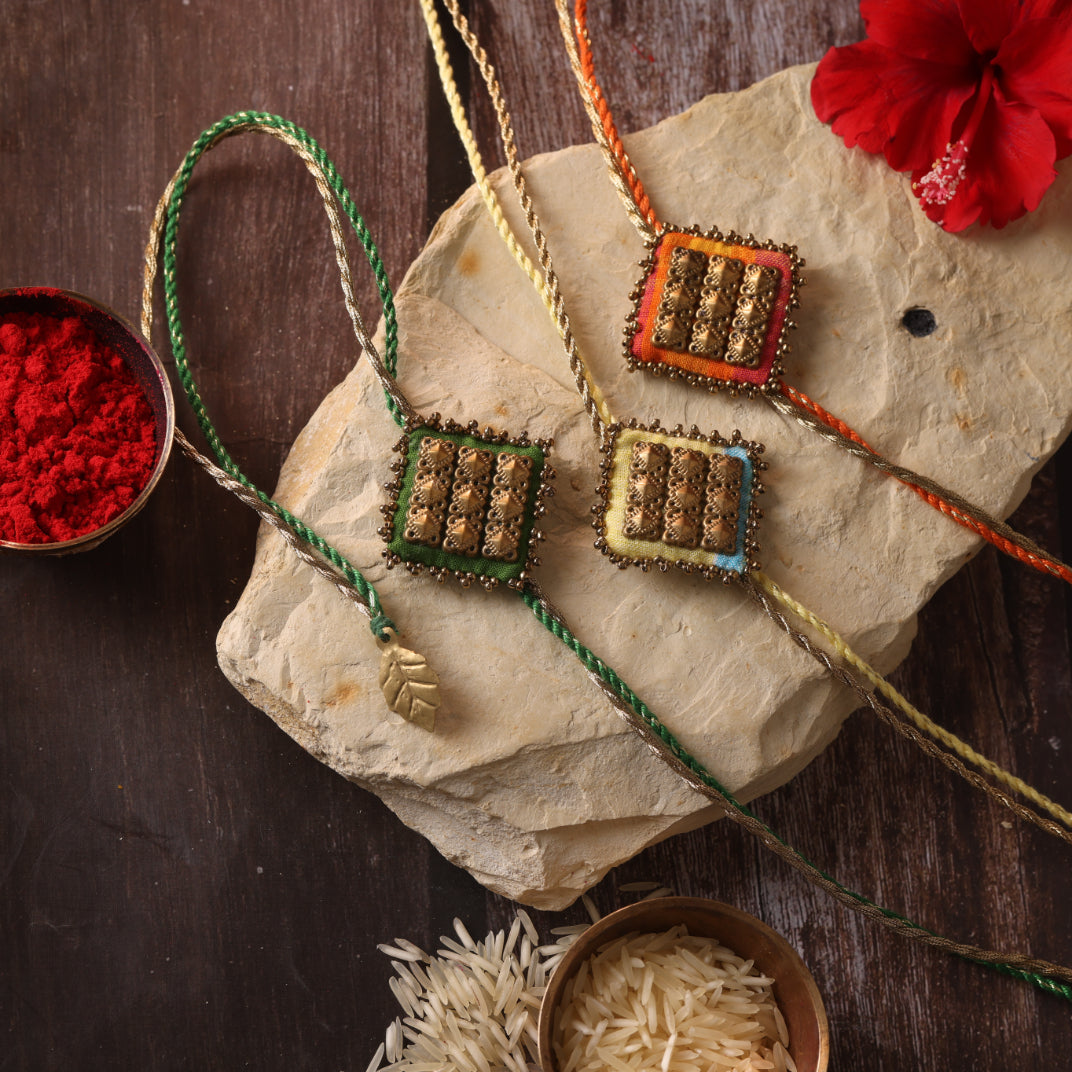 MAJESTIC SQAURE BRASS RAKHI - Set of 3