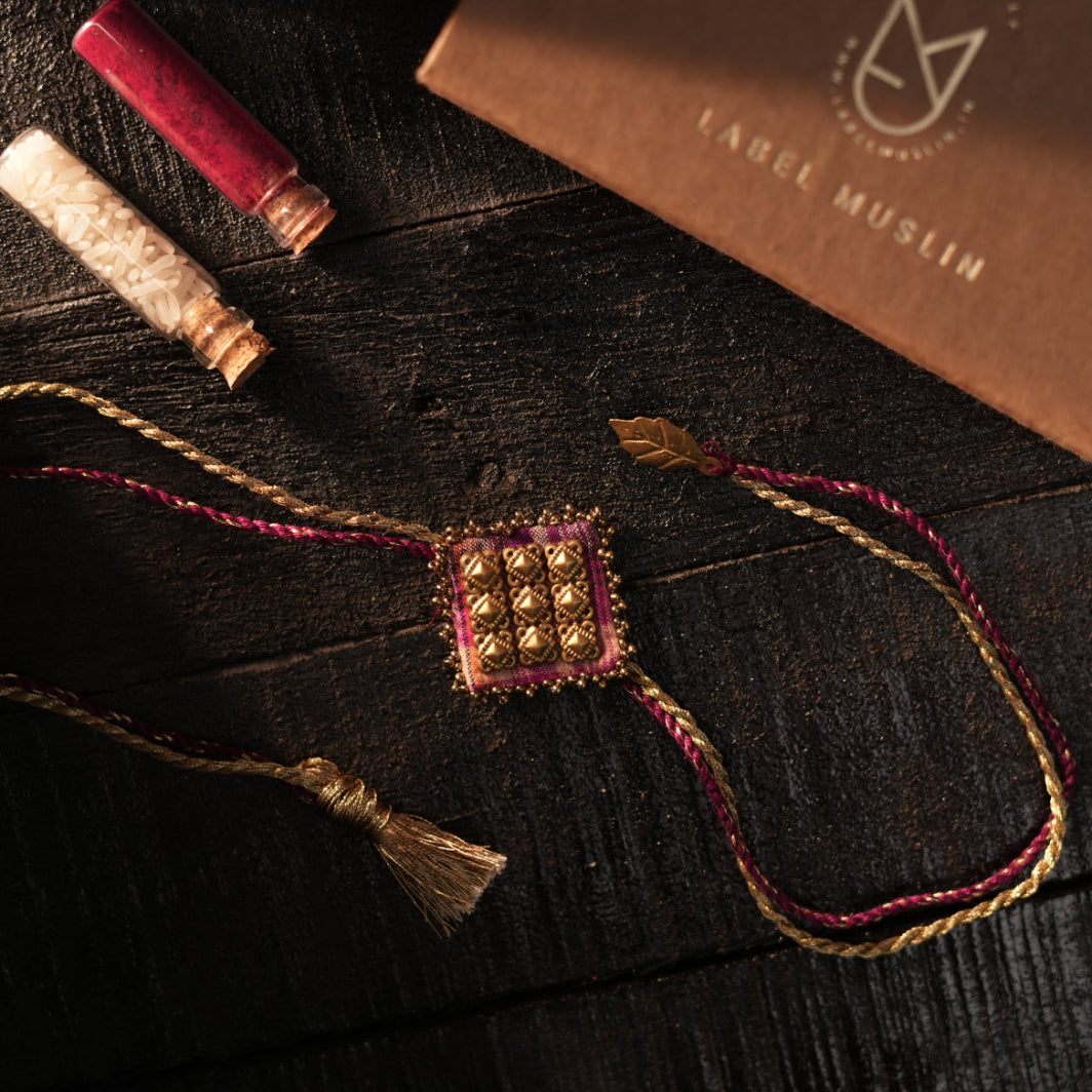MAROON -  MAJESTIC SQAURE BRASS RAKHI